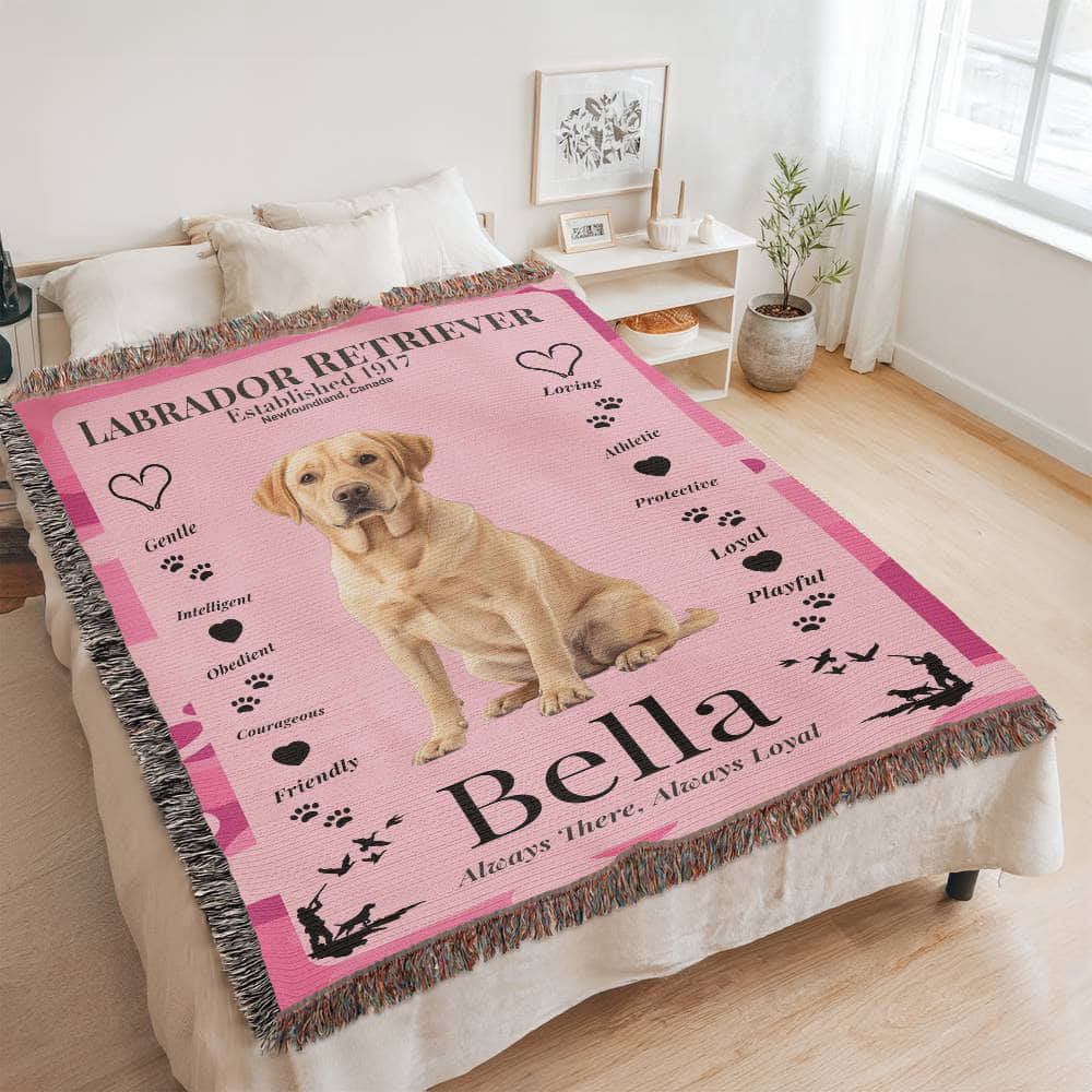 Pink blanket with a Labrador Retriever design and text on a bed in a room. Personalize your woven blanket with your favorite Labrador's photo and Name.