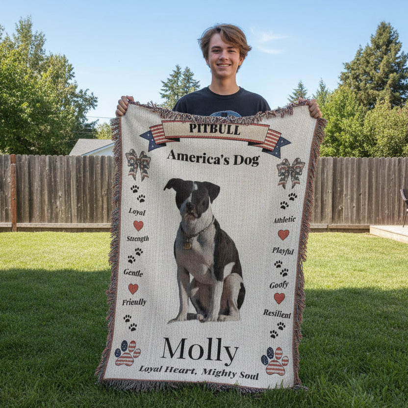 boy holding a blanket with a pitbull design and text outdoors. Personalize your favorite picture of your Pitte on this custom woven blanket with their name.