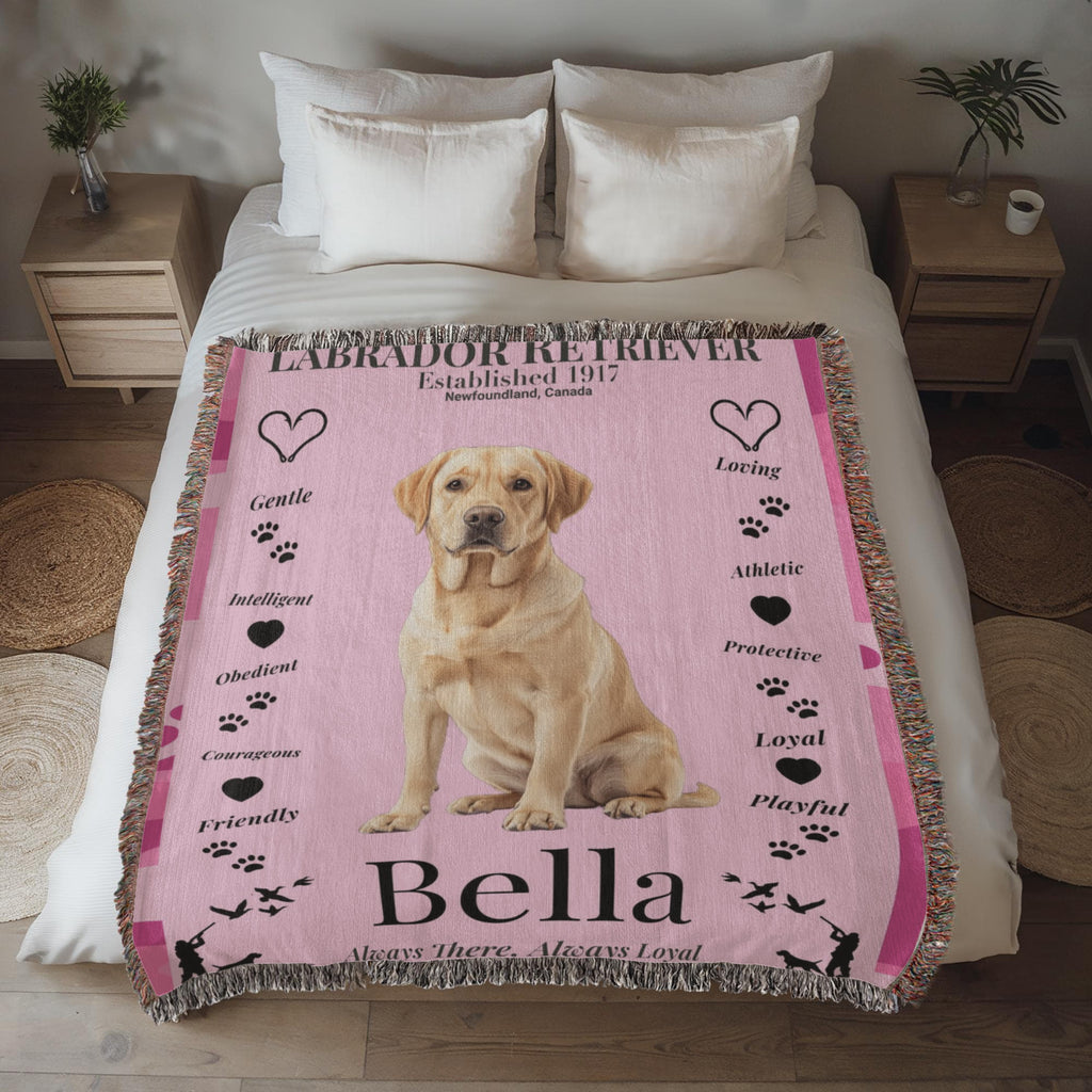 Pink blanket with a Labrador Retriever design and text on a bed in a bedroom setting. Personalize your woven blanket with your favorite Labrador's photo and Name.