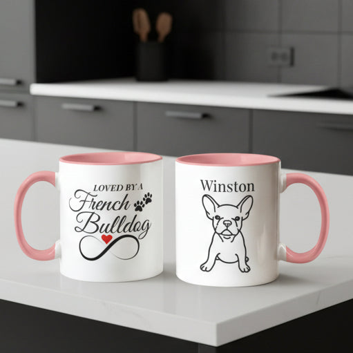 Two mugs with red interiors and handles, featuring text and a dog illustration on a light background.