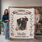 Two people holding a blanket with a Pitbull design and text about the breed. Personalize your favorite picture of your Pitte on this custom woven blanket with their name.