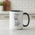 White mug with black handle featuring a dog illustration and 'Charlie' text, placed on a wooden surface with stationery items.