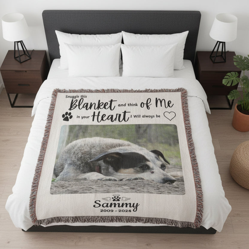 Blanket with a photo of a dog and text on a bed in a bedroom setting