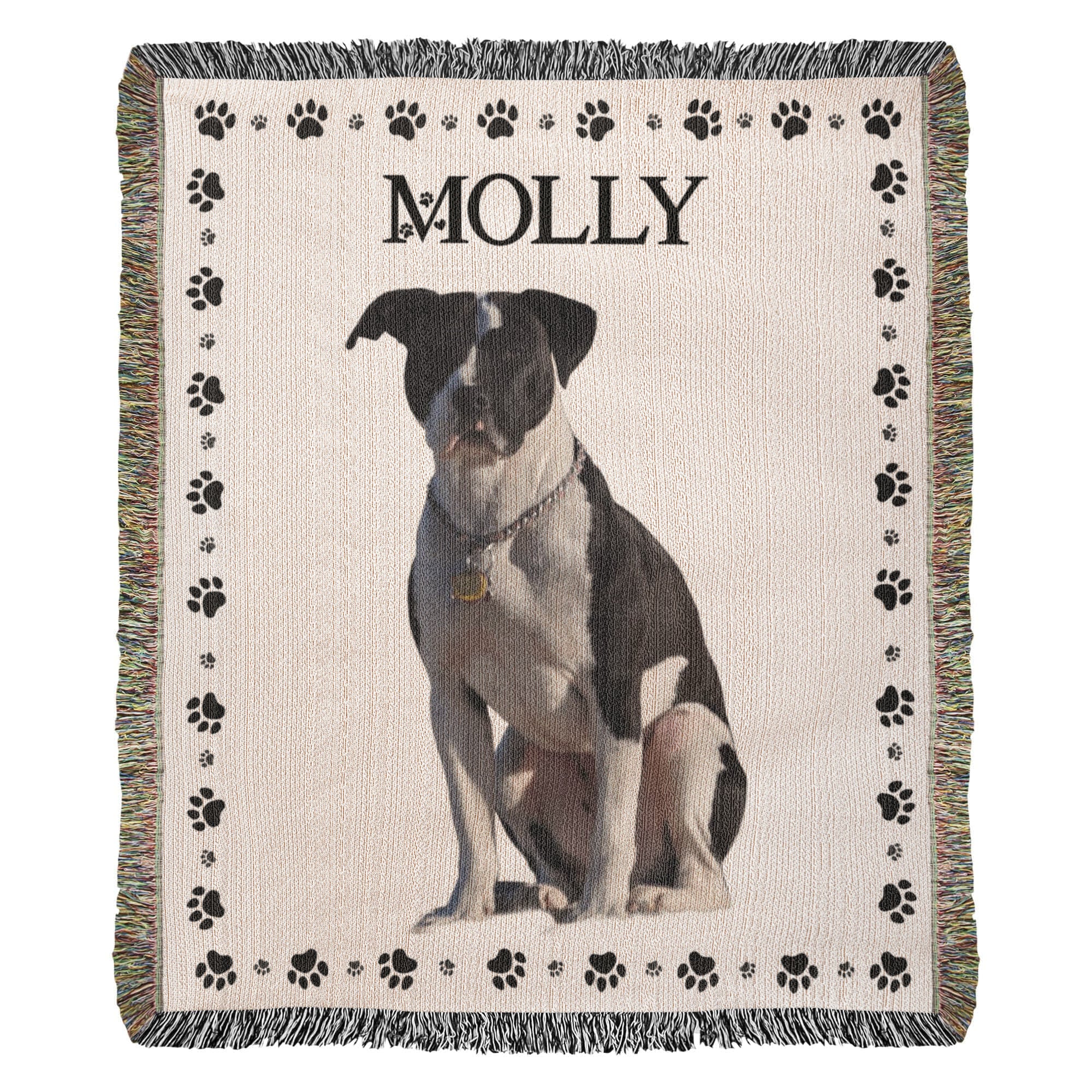 Woven blanket with a dog's portrait and name 'Molly' on a beige background with black paw prints.