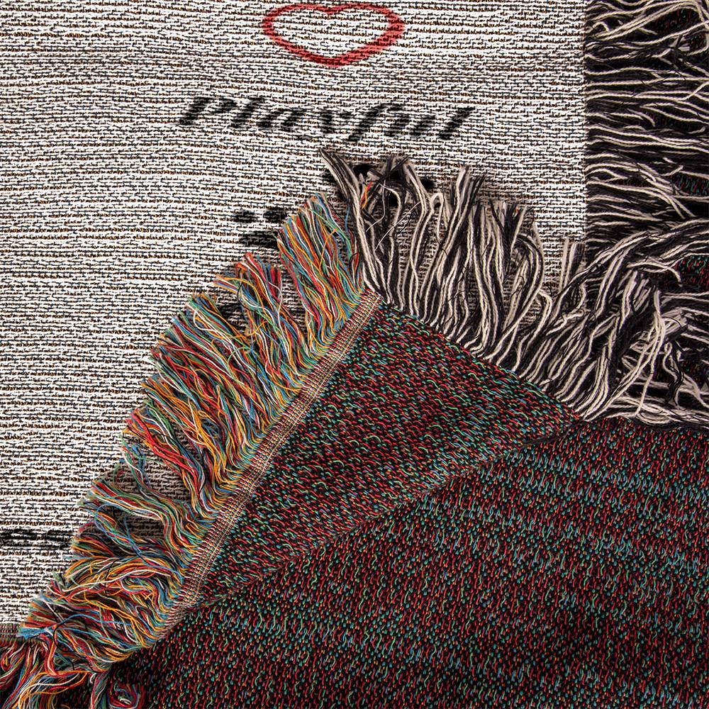 Textured fabric with colorful fringes and the word 'Playful' on a patterned background.