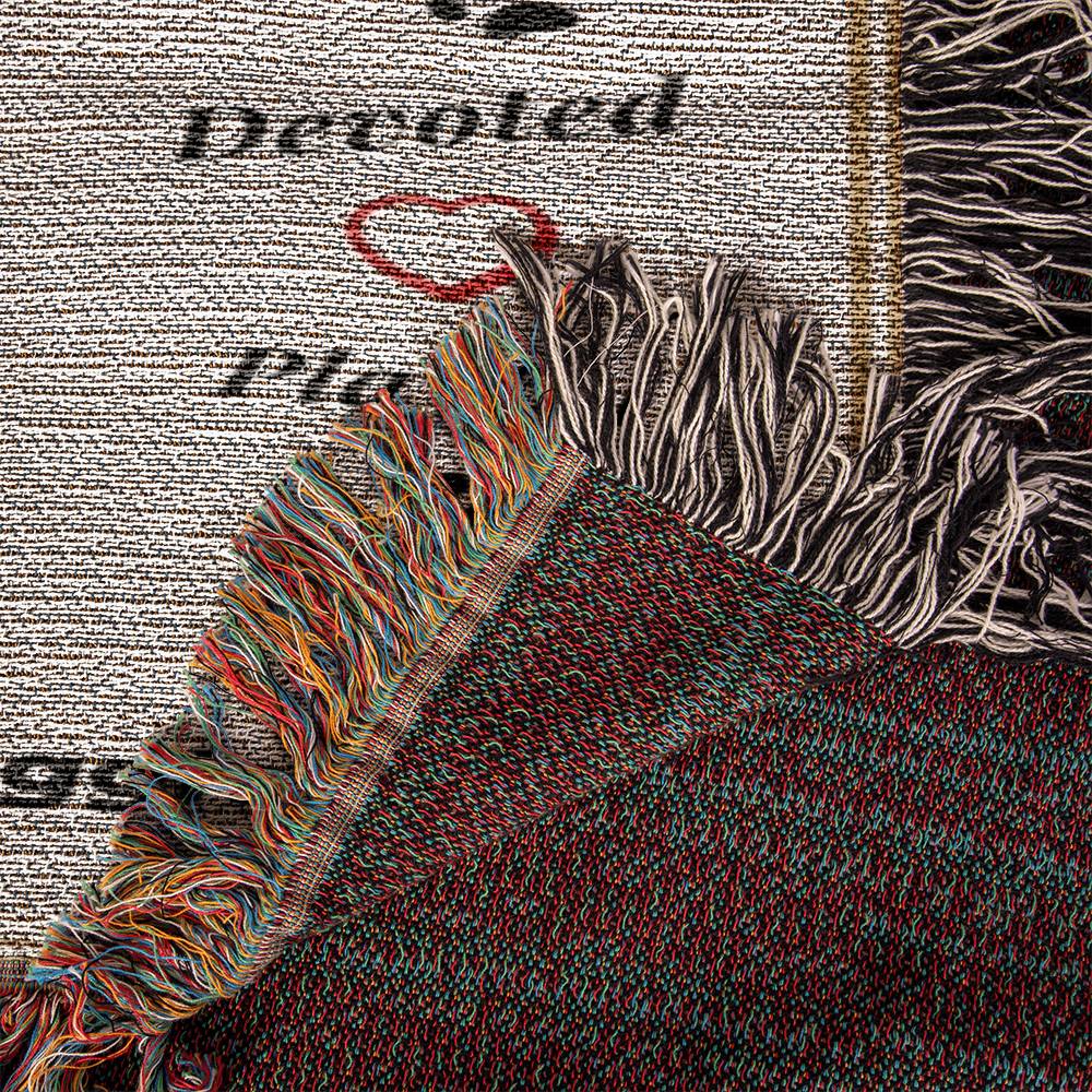 Textile with fringes and a textured pattern on a newspaper background