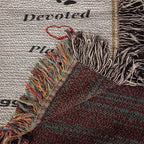 Textile with fringes and a textured pattern on a newspaper background