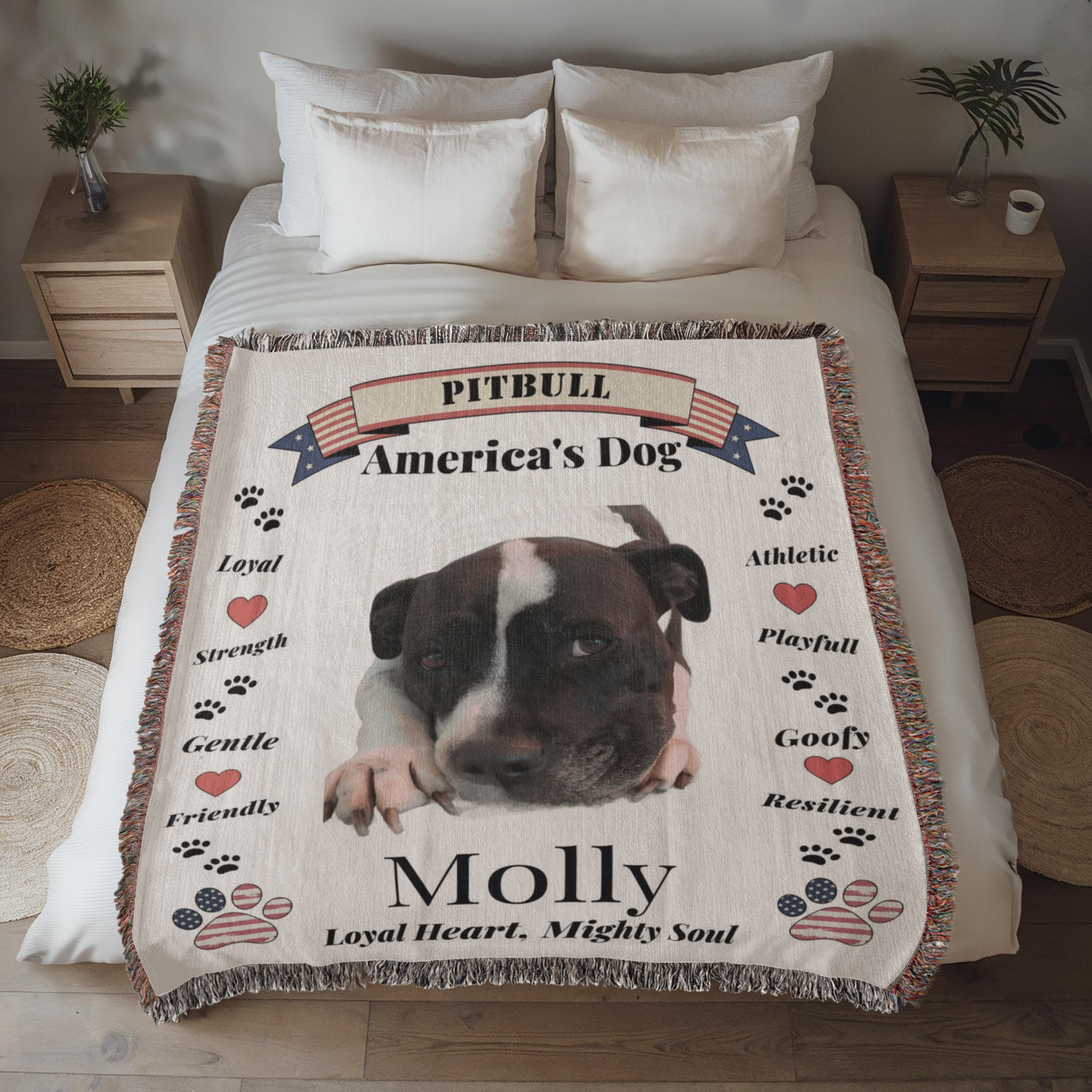 Pitbull-themed blanket with text on a bed in a bedroom setting. Personalize your favorite picture of your Pitte on this custom woven blanket with their name.