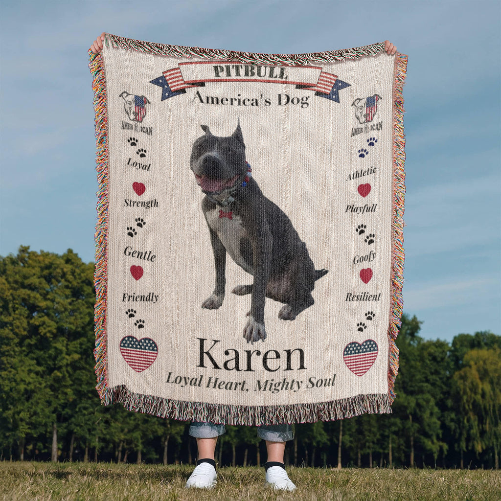 Blanket with a pitbull design and text about the breed, held by a person in an outdoor setting. Personalize your woven blanket with your favorite picture of your Pittie with their name.