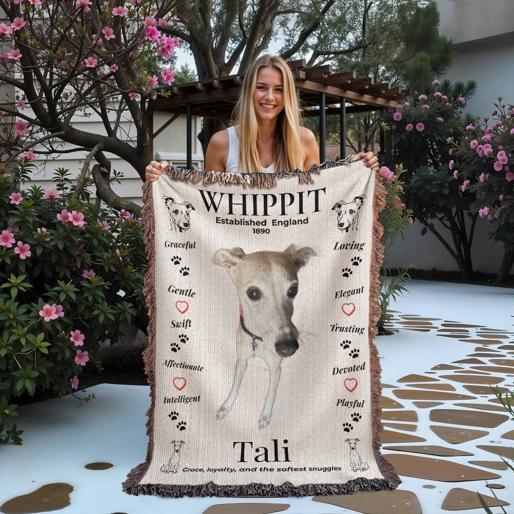 Woman holding a blanket with a whippet design and text outdoors. Personalize your woven blanket with your favorite photo of your Whippit.