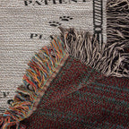 Close-up of a textured fabric with colorful fringe against a newspaper background
