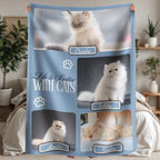 Blanket with images of cats and text 'Life is Better With Cats' held by a person in a room.