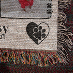 Textile with paw print design, heart symbol, and colorful fringe