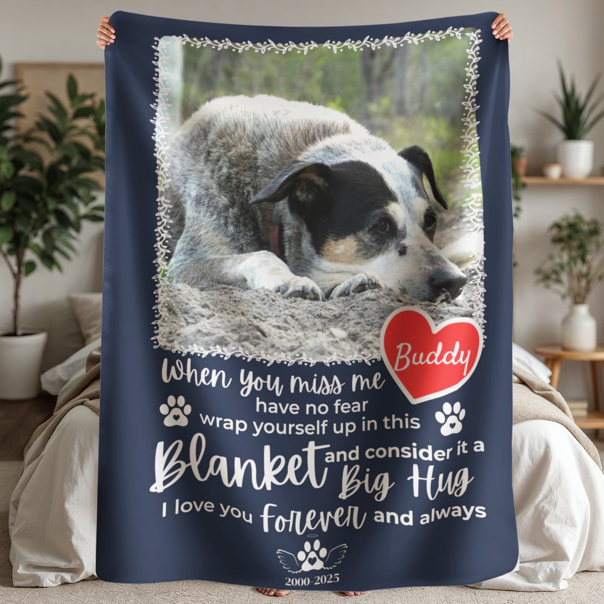 Navy blue blanket with a dog photo and personalized text in a home setting