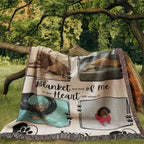 Blanket with dog-themed images and text, placed outdoors on a tree branch.