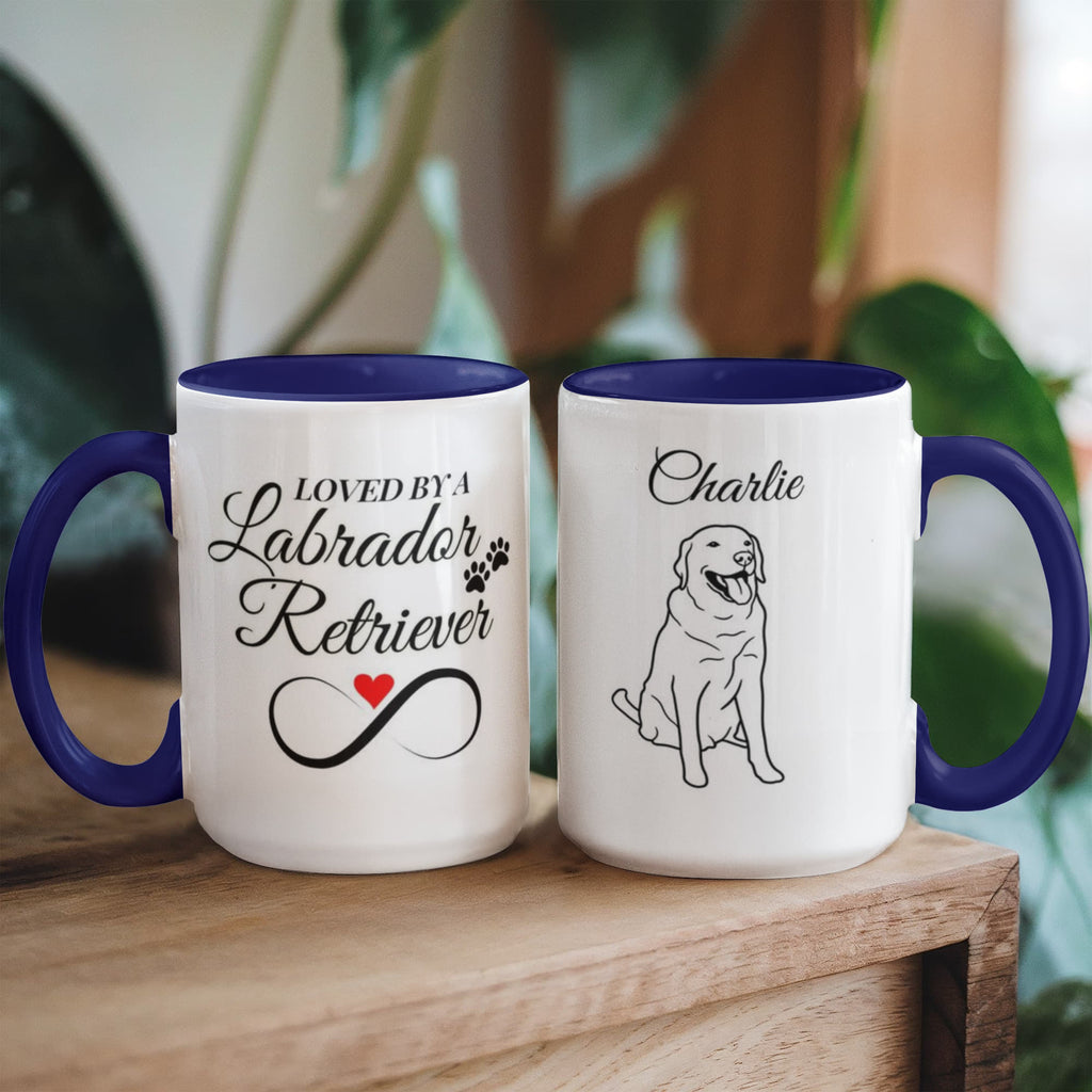 Two mugs with blue interior and handle, one featuring text and the other a dog illustration, on a wooden surface.