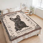 Blanket with a French Bulldog design and text on a bed in a room.Personalized with your Frenchie's photo and name.