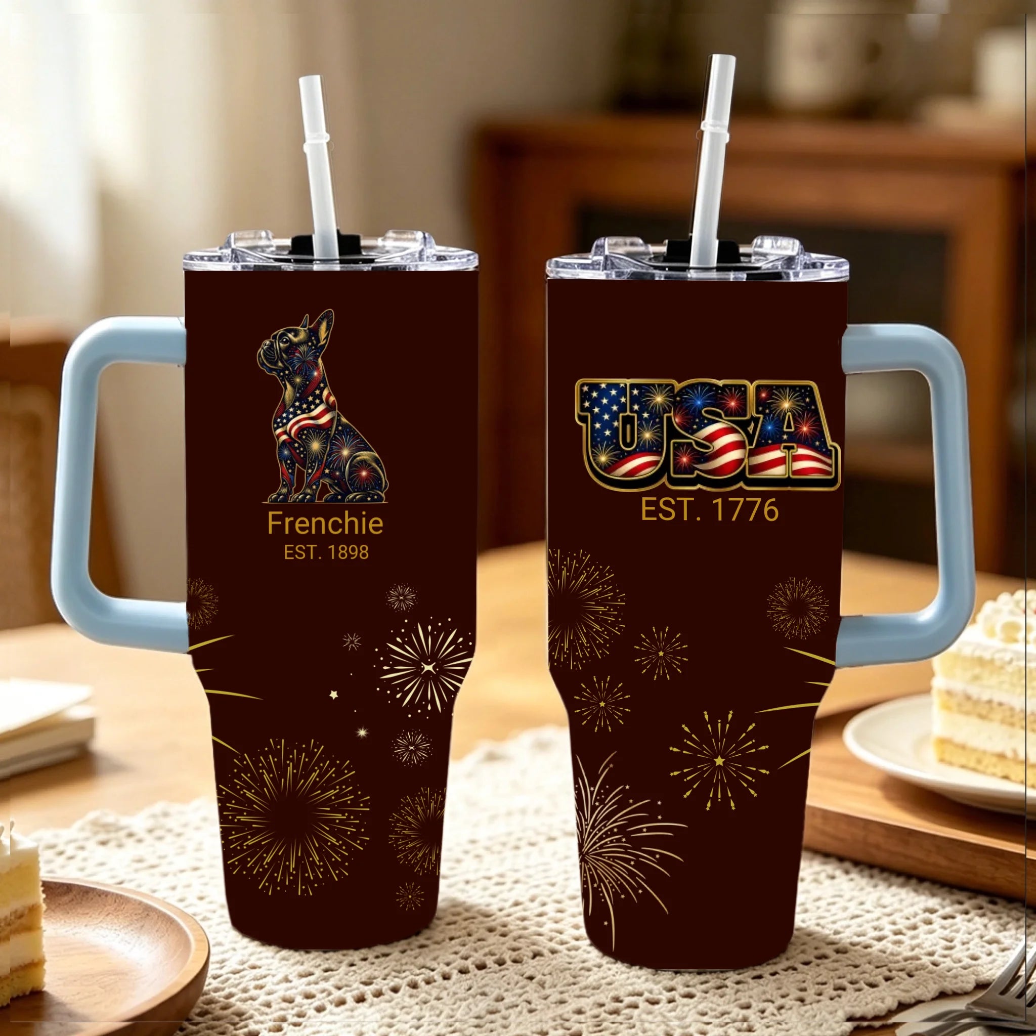 Two tumblers with handles on a table, featuring 'Frenchie' and 'USA' designs.