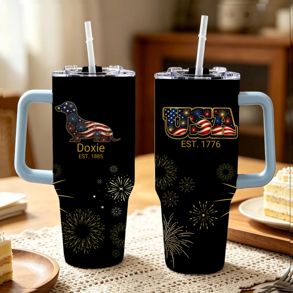 Two black tumblers with handles on a table, featuring patriotic designs.
