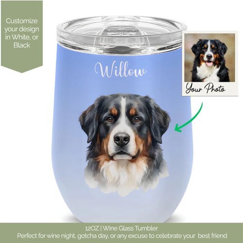 A personalized 12oz wine glass tumbler with a light blue background, featuring a printed Bernese Mountain Dog portrait and the name 'Willow' in white script. A small inset photo of a real dog and a green arrow illustrate the custom photo feature.