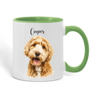 A white ceramic mug with a green handle and green interior, featuring a printed portrait of a golden doodle dog and the name 'Cooper' in black script on the front.
