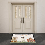 A rectangular Halloween-themed doormat placed in front of double cream-colored front doors. The mat features the text 'Halloween's Number 1 Rule.