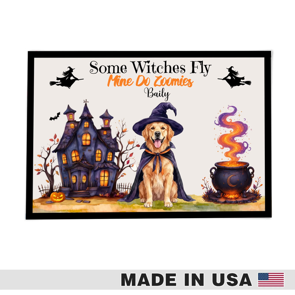 A framed Halloween-themed art print featuring a golden retriever dog in a witch hat beside a haunted house and a bubbling cauldron, with the text 'Some Witches Fly Mine Do Zoumies Badly.' A 'MADE IN USA' banner appears along the bottom of the overall image.