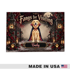 A Halloween-themed decorative sign or poster featuring a golden retriever dressed as a vampire with the text 'Fangs for Visiting' and 'Bailey.' The design includes a full moon, bats, dark gates, roses, pumpkins, and a smoky gothic background.