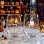 Personalized ghost-costume dog with pumpkins Halloween stemless wine glasses on a windowsill with glowing jack-o-lanterns and fall decor