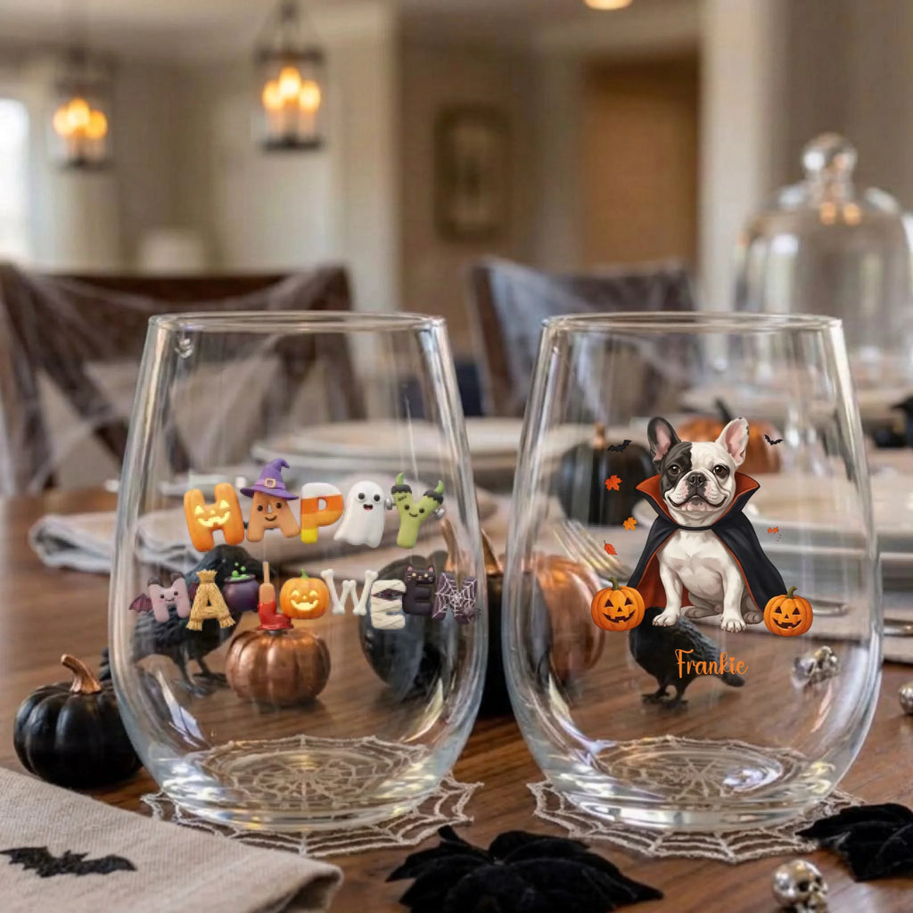 Pair of personalized Halloween stemless wine glasses with a vampire-costume dog with pumpkins on a dining table set for a Halloween party