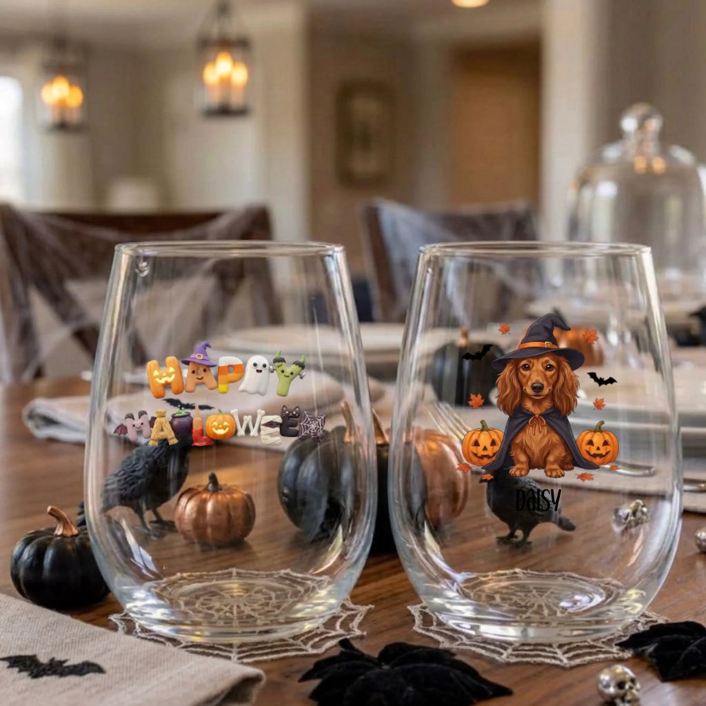 Pair of personalized Halloween stemless wine glasses with a witch-costume dog with pumpkins on a dining table set for a Halloween party