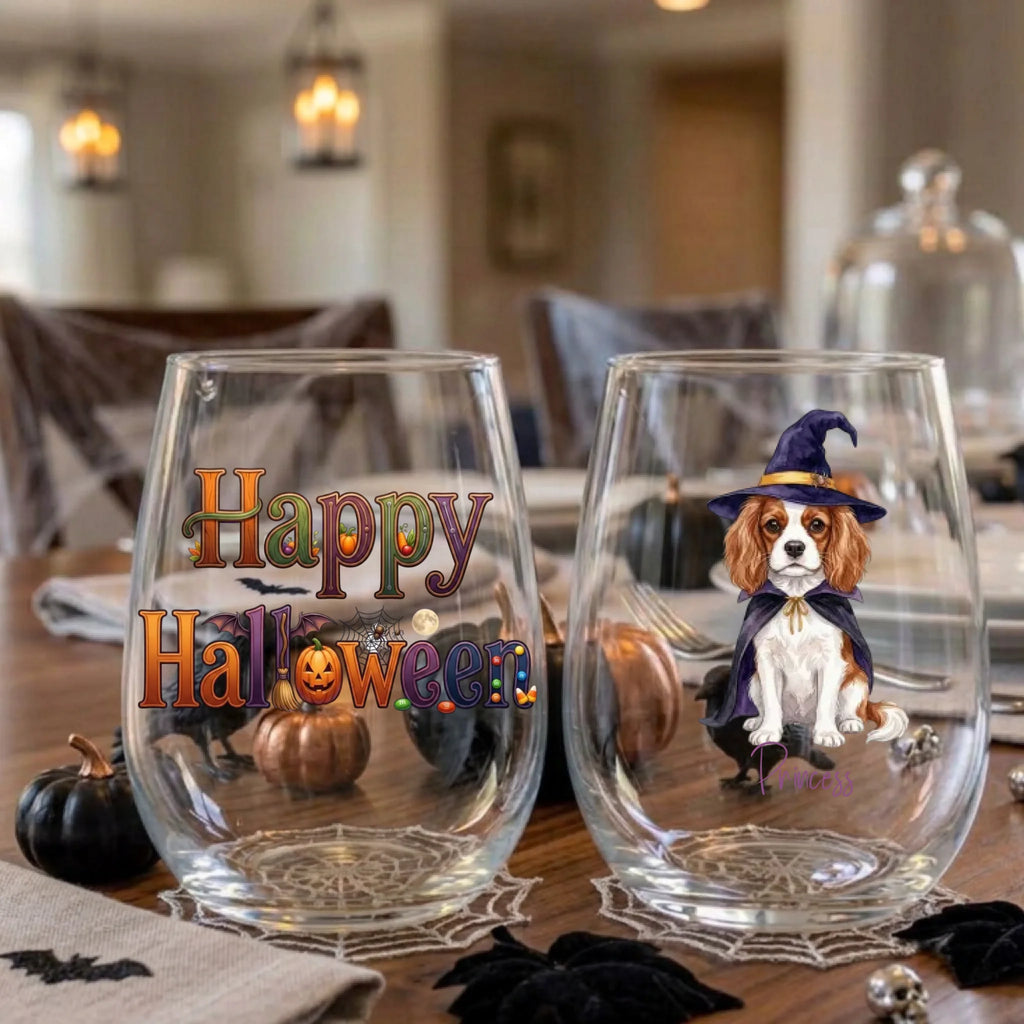 Happy Halloween and witch dog stemless wine glasses on a Halloween dinner table with spiderweb placemats