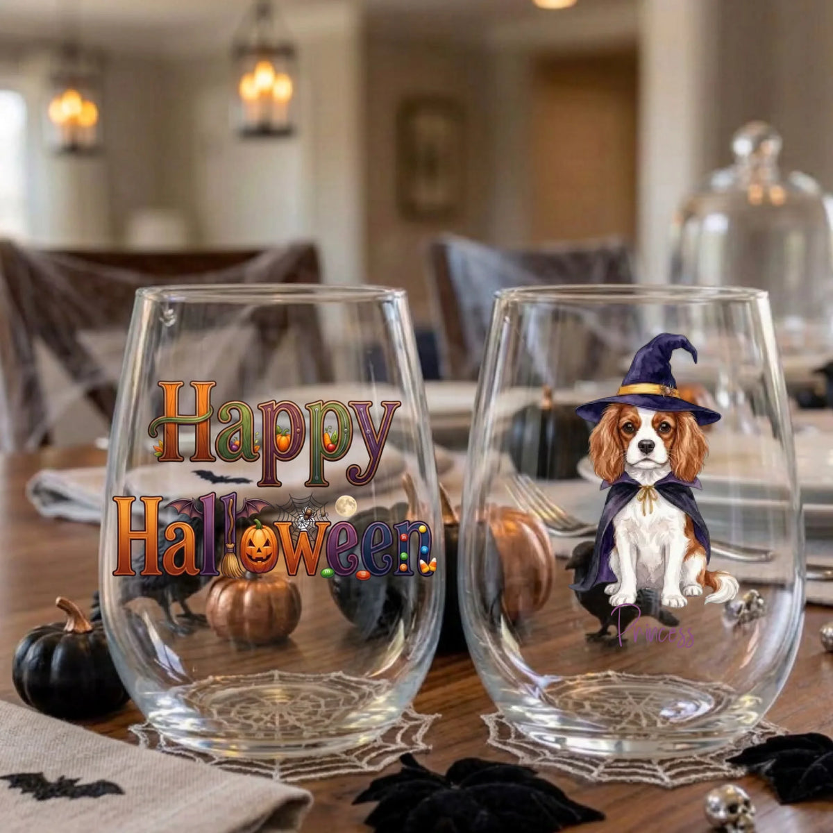 Happy Halloween and witch dog stemless wine glasses on a Halloween dinner table with spiderweb placemats