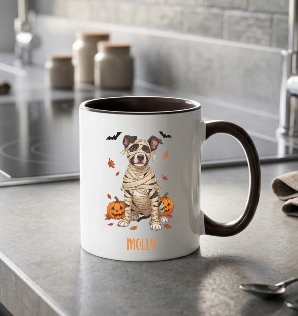 Personalized mummy dog Halloween coffee mug with black handle on a kitchen counter