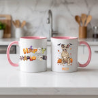 Pink handle Halloween mugs: Happy Halloween design and personalized mummy dog mug, on a marble counter