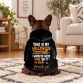 Dog wearing a black hoodie that says This Is My Halloween Costume with name Penelope