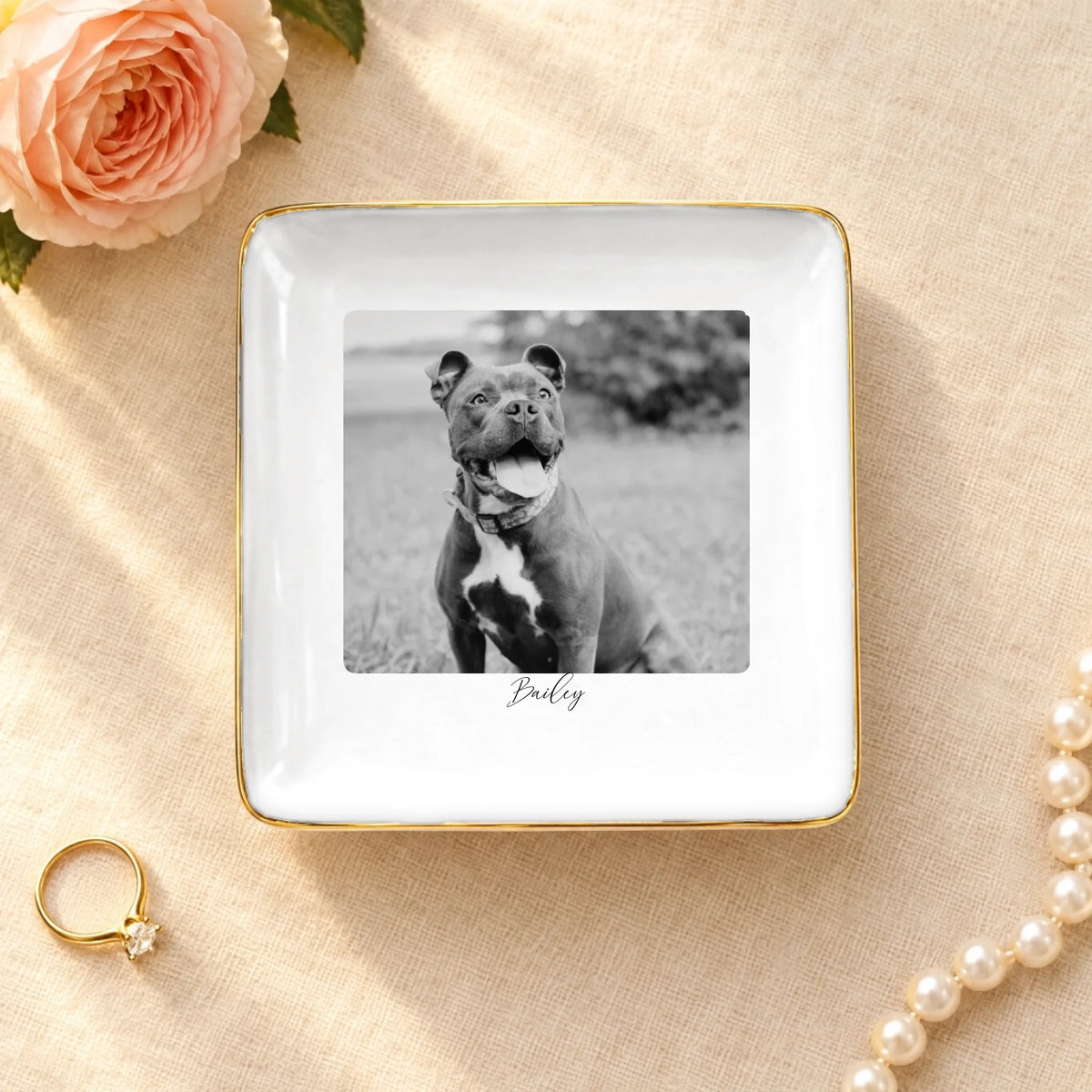 Personalized black and white pet photo on a square ceramic ring dish with gold rim