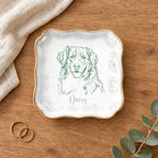 Wavy square floral pet sketch ring dish styled on a wooden table with linen