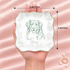 Wavy square floral pet sketch ring dish resting on an open hand, 4.1 inches across