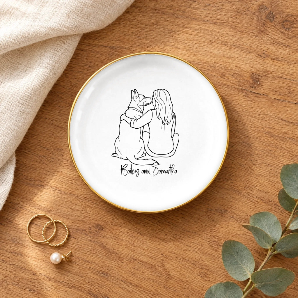 Line drawing person and dog round ring dish on a wooden table with linen and eucalyptus