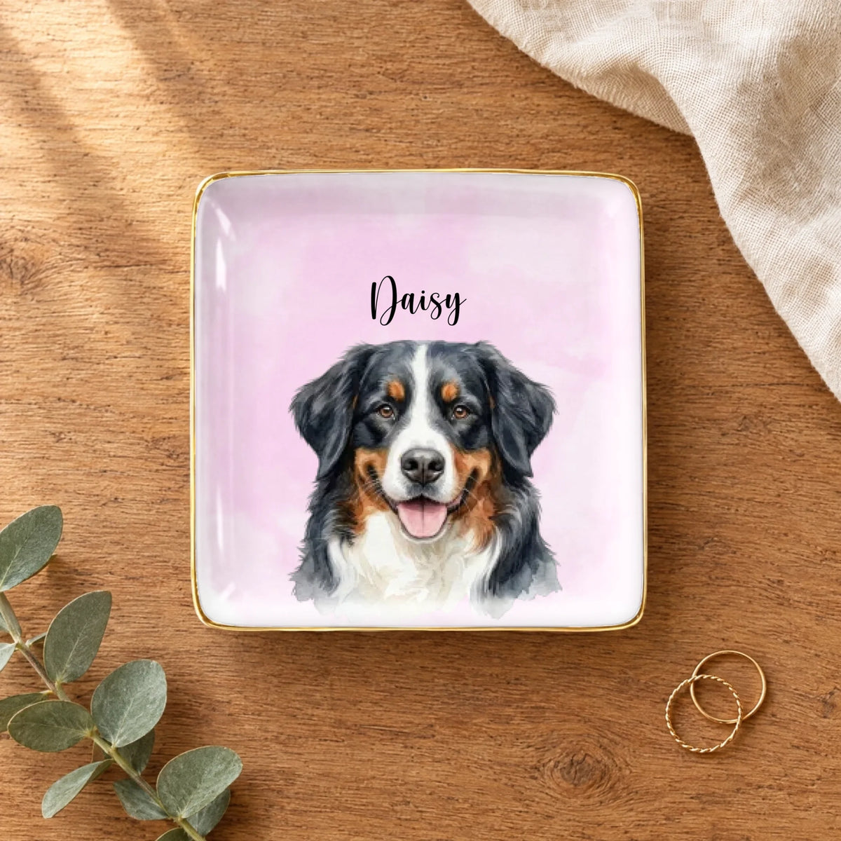 Personalized watercolor pet portrait square ring dish on a wooden table with linen, eucalyptus and gold rings