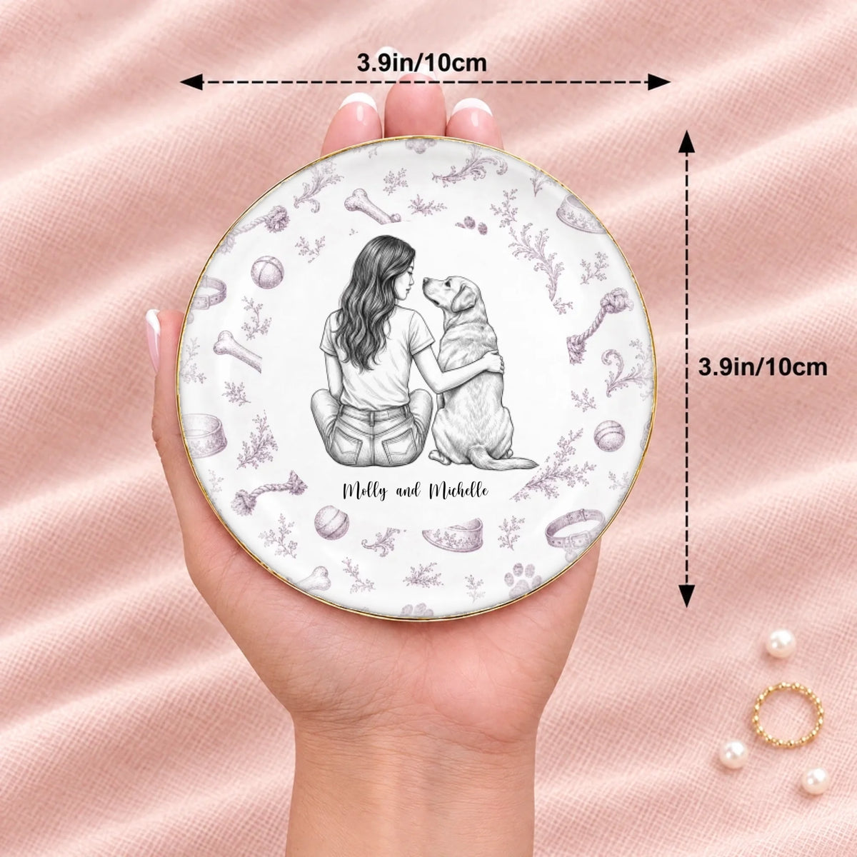 Hand holding a vintage sketch person and pet round ring dish, 3.9 inches across