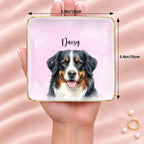 Personalized pet portrait square ring dish resting on an open hand, 3.9 inches across