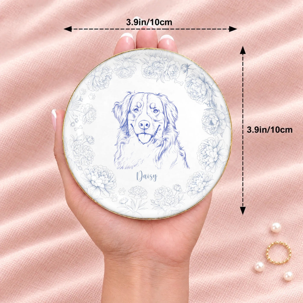Round floral pet sketch ring dish resting on an open hand, 3.9 inches across