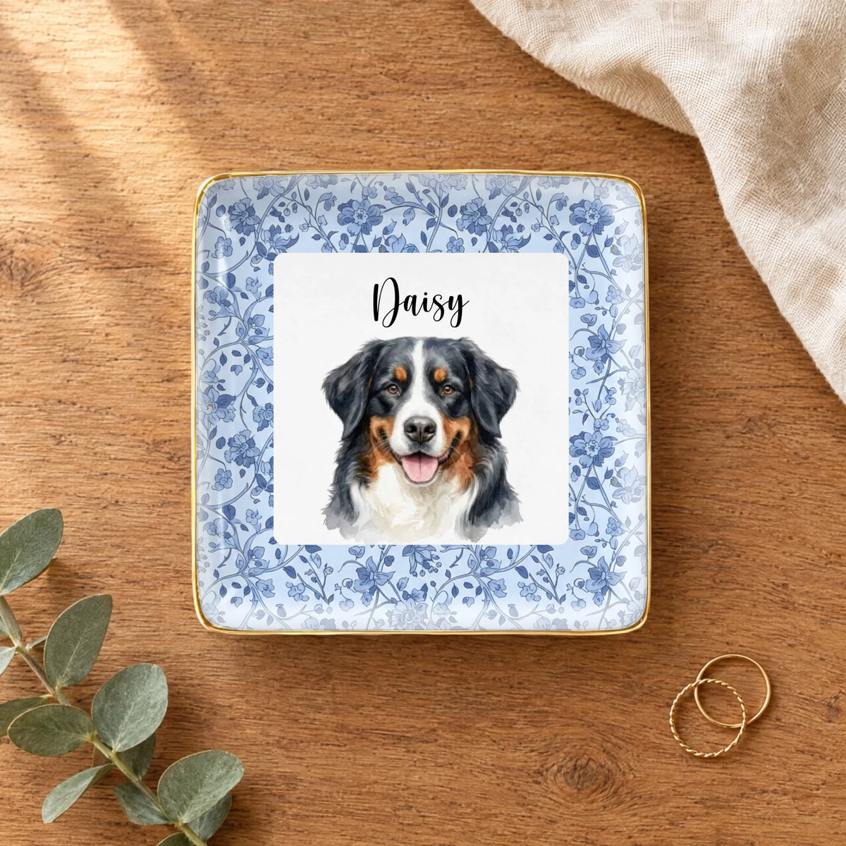 Personalized floral watercolor pet portrait square ring dish on a wooden table with linen and eucalyptus