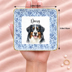 Personalized floral pet portrait square ring dish resting on an open hand, 3.9 inches across