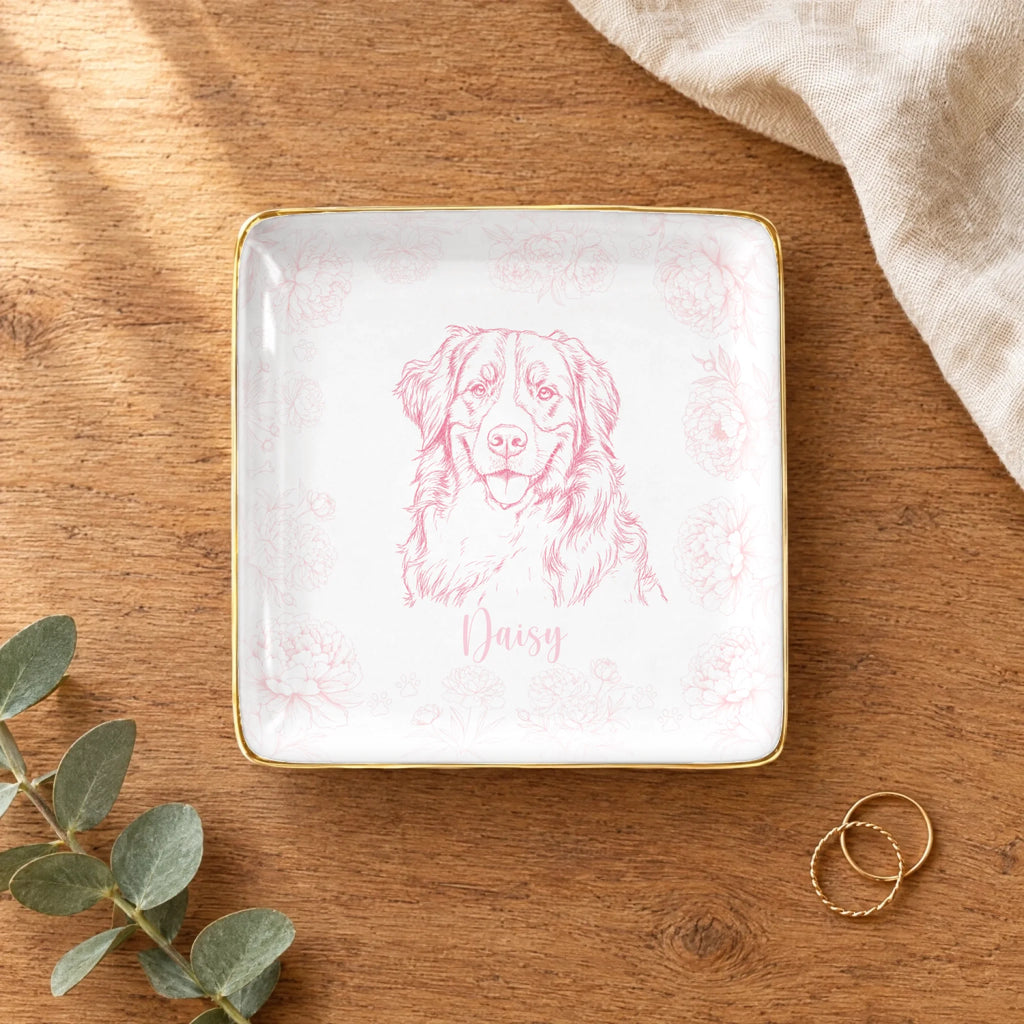 Square floral pet sketch ring dish styled on a wooden table with linen