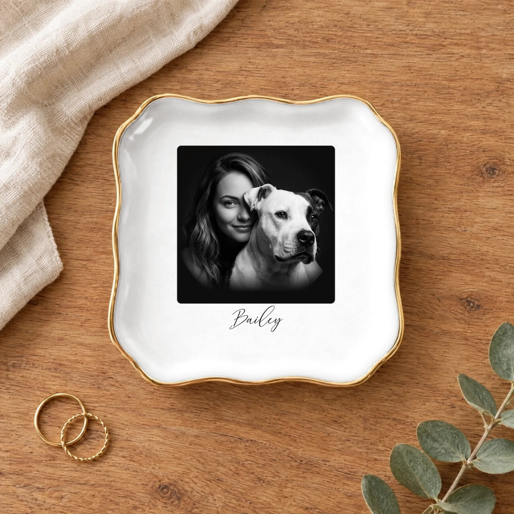 Black and white studio portrait wavy square ring dish on a wooden table with linen and eucalyptus