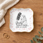 Vintage sketch person and pet wavy square ring dish on a wooden table with linen and eucalyptus
