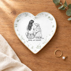 Vintage sketch person and pet heart ring dish on a wooden table with linen and eucalyptus